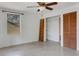Bedroom with large windows, ceiling fan, and closet space for storage and comfort at 218 32Nd W St, Bradenton, FL 34205