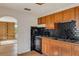 Cozy kitchen showcasing black backsplash, ample cabinet space, and included appliances at 218 32Nd W St, Bradenton, FL 34205