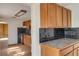 Bright kitchen featuring wooden cabinets with black subway tile backsplash and flooring at 218 32Nd W St, Bradenton, FL 34205