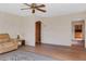 Inviting living room with hardwood floors, neutral walls, and a view to the kitchen at 218 32Nd W St, Bradenton, FL 34205