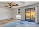 Bright room features sliding glass doors to outside and large window for plenty of natural light at 218 32Nd W St, Bradenton, FL 34205