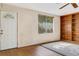 Inviting living room with built-in shelves, wood floors, and a bright window at 218 32Nd W St, Bradenton, FL 34205