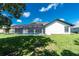 Lush backyard showcasing a screened pool area for private relaxation and enjoyment at 234 Antofagasta St, Punta Gorda, FL 33983