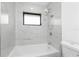 Bright bathroom with a tiled tub and shower, perfect for relaxing after a long day at 234 Antofagasta St, Punta Gorda, FL 33983