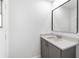 Bathroom features a modern vanity with drawers, a mirror and window nearby at 234 Antofagasta St, Punta Gorda, FL 33983