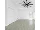 Bedroom features a modern ceiling fan, and light tile floors at 234 Antofagasta St, Punta Gorda, FL 33983