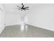 Spacious bedroom features a ceiling fan and light tile floors at 234 Antofagasta St, Punta Gorda, FL 33983