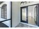 Light-filled entryway features tiled floors and a clear view of the living area at 234 Antofagasta St, Punta Gorda, FL 33983