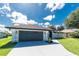 Charming home featuring a well-maintained garage and beautiful landscaping at 234 Antofagasta St, Punta Gorda, FL 33983