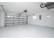Spacious two-car garage featuring a clean, epoxy floor, automatic door opener, and ample room for storage at 234 Antofagasta St, Punta Gorda, FL 33983