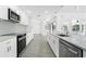 Beautiful kitchen includes stainless steel appliances, white cabinets, and quartz countertops at 234 Antofagasta St, Punta Gorda, FL 33983