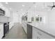 This kitchen offers stainless steel appliances, pendant lighting, and white cabinets at 234 Antofagasta St, Punta Gorda, FL 33983
