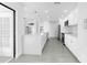 This kitchen showcases a quartz island, white cabinets, and stainless steel appliances at 234 Antofagasta St, Punta Gorda, FL 33983