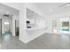 Open kitchen has white cabinets, quartz countertops, and stainless steel appliances at 234 Antofagasta St, Punta Gorda, FL 33983