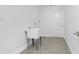 Laundry room has a utility sink, neutral paint, and light tile floors at 234 Antofagasta St, Punta Gorda, FL 33983