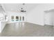 Spacious living room includes a ceiling fan, tile flooring, and bar area at 234 Antofagasta St, Punta Gorda, FL 33983