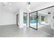 Bright living room features a large sliding glass doors overlooking pool at 234 Antofagasta St, Punta Gorda, FL 33983