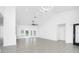 Living room features a modern chandelier, ceiling fan, and tile floors throughout at 234 Antofagasta St, Punta Gorda, FL 33983