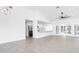 Open-concept living space featuring an island with bar seating and tiled floors that flow throughout at 234 Antofagasta St, Punta Gorda, FL 33983
