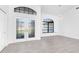 Bright living room features neutral paint colors, tiled flooring, and an abundance of natural light at 234 Antofagasta St, Punta Gorda, FL 33983