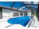 A stunning view of a screened pool area, perfect for entertaining and relaxation at 234 Antofagasta St, Punta Gorda, FL 33983