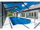 A beautiful screened-in pool with crystal clear water and a spacious deck for lounging at 234 Antofagasta St, Punta Gorda, FL 33983