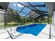 A beautiful screened-in pool with crystal clear water and a spacious deck for lounging at 234 Antofagasta St, Punta Gorda, FL 33983