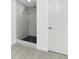 Walk-in shower features marble surround and black stone flooring at 234 Antofagasta St, Punta Gorda, FL 33983