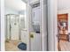Bathroom featuring step-in shower and stacked washer/dryer closet at 25100 Sandhill Blvd # V202, Punta Gorda, FL 33983