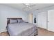 Bedroom featuring wood-look flooring, neutral paint, and a closet for storage at 25100 Sandhill Blvd # V202, Punta Gorda, FL 33983
