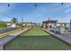 Well-maintained bocce ball court with shaded seating areas, providing a relaxing and enjoyable outdoor activity for residents at 25100 Sandhill Blvd # V202, Punta Gorda, FL 33983