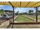 Bocce ball court with surrounding seating and shade, providing a fun and social recreational activity for residents at 25100 Sandhill Blvd # V202, Punta Gorda, FL 33983