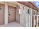 Close up view of a condo entrance with a unit number and door, highlighting the building's access point at 25100 Sandhill Blvd # V202, Punta Gorda, FL 33983