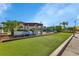 Community recreation area featuring a bocce ball court, seating areas, and grilling stations for social gatherings and outdoor fun at 25100 Sandhill Blvd # V202, Punta Gorda, FL 33983