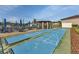 Shuffleboard courts with nearby seating and shade, offering a leisurely recreational activity for residents at 25100 Sandhill Blvd # V202, Punta Gorda, FL 33983