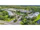 Expansive community with well-maintained landscaping, a community pool, and mature trees throughout at 26548 Castleview Way, Wesley Chapel, FL 33544