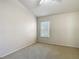 Carpeted bedroom featuring a large window for natural light at 26548 Castleview Way, Wesley Chapel, FL 33544