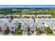 Charming townhomes with two-car garages, brick-paver driveways, and a well-manicured lawn at 26548 Castleview Way, Wesley Chapel, FL 33544