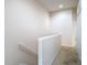 Second floor hallway that gives access to bedrooms; hallway has neutral paint and carpet at 26548 Castleview Way, Wesley Chapel, FL 33544