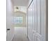 Hallway featuring closet doors and bedroom at 26548 Castleview Way, Wesley Chapel, FL 33544