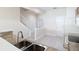 Bright kitchen showcasing modern appliances, a double sink, granite countertops, and easy access to the staircase at 26548 Castleview Way, Wesley Chapel, FL 33544