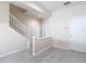 Open living space with neutral walls and a staircase leading to the upper level at 26548 Castleview Way, Wesley Chapel, FL 33544