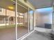 The sliding doors of this screened-in patio provide views to the green yard at 26548 Castleview Way, Wesley Chapel, FL 33544
