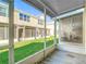 Cozy screened patio with views of the lush lawn at 26548 Castleview Way, Wesley Chapel, FL 33544