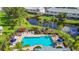 Beautiful community pool surrounded by lush landscaping at 26548 Castleview Way, Wesley Chapel, FL 33544