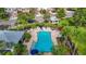 Community pool with lounge chairs and umbrellas at 26548 Castleview Way, Wesley Chapel, FL 33544