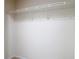 This empty walk-in closet has shelving on top for storage at 26548 Castleview Way, Wesley Chapel, FL 33544