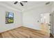 Bright bedroom featuring wood-look floors and a window at 2813 Sally Ln, North Port, FL 34286