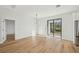 Light-filled room with sliding glass doors and hardwood floors for a bright and modern look at 2813 Sally Ln, North Port, FL 34286