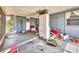 Back porch with wood floors and blue siding at 2818 Olympic St, Sarasota, FL 34231